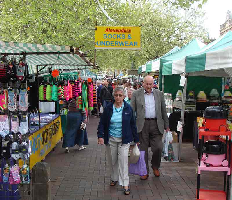 Shoppers and stalls.